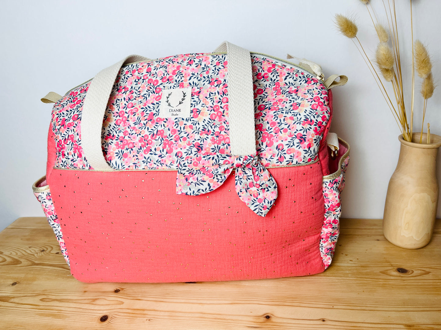 Aimé le sac à langer corail et Pois de senteur