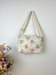 Prototype sac Colettesouple en sherpa fleuri pastel gansé de biais