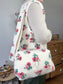 Prototype sac Colette souple en sherpa fleuri fushia gansé de biais