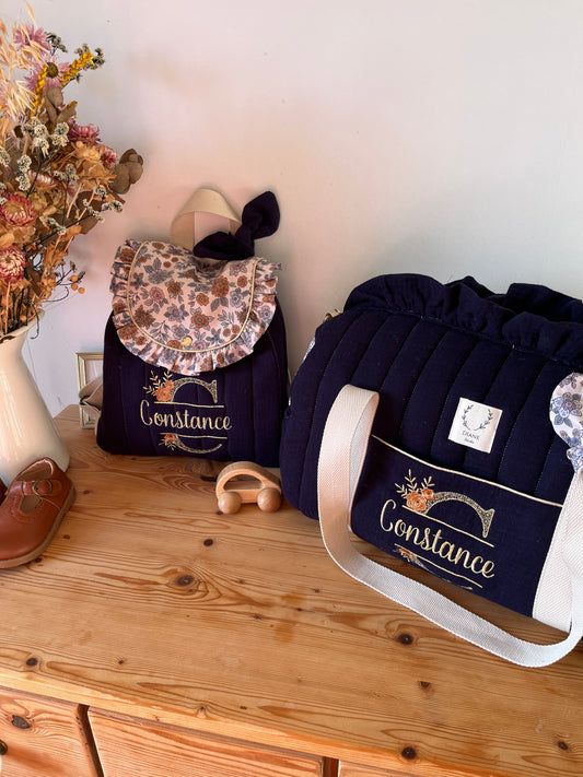 Ensemble : sac polochon et sac à dos Eglantine initiale dentelle