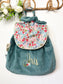Le sac à dos Eglantine velours bleu vert et Liberty poppy initiale florale