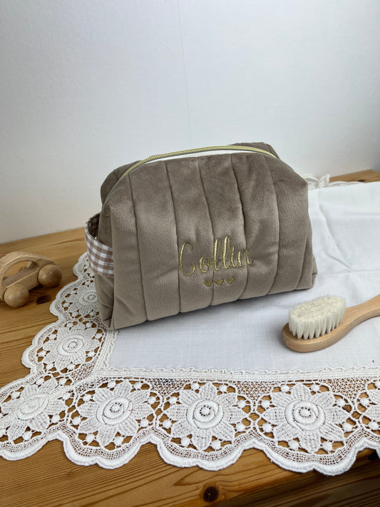 Set includes: Toiletry bag, blanket, doll, notebook cover, and bonnet 