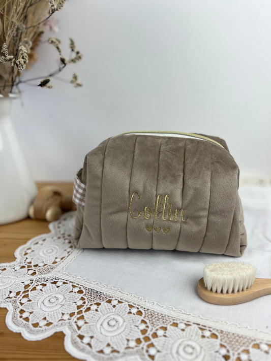 Set includes: Toiletry bag, blanket, doll, notebook cover, and bonnet 