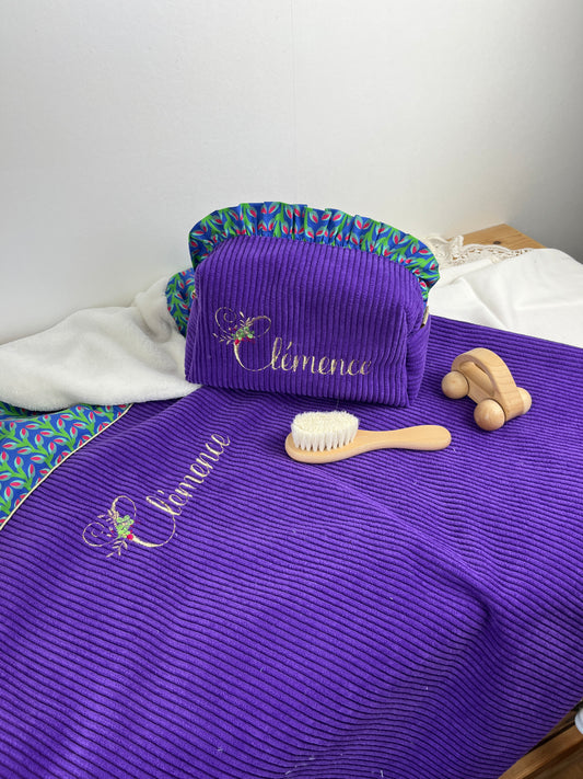 Set includes: Toiletry bag, blanket, doll, notebook cover, and bonnet 