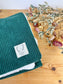 La couverture velours vert sapin et bloom noir