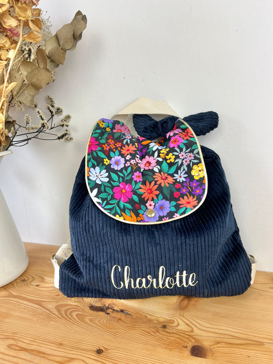 Le sac à dos Églantine velours marine et bloom noir