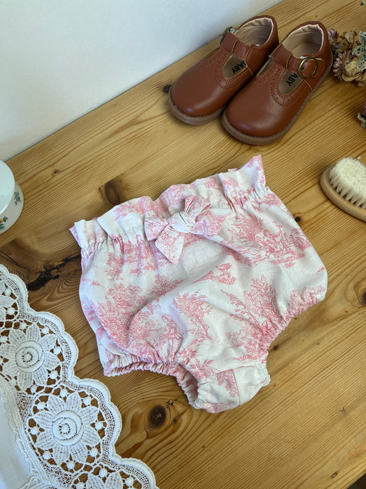 Set includes: diaper bag, notebook cover, doll, bloomers, and headband 