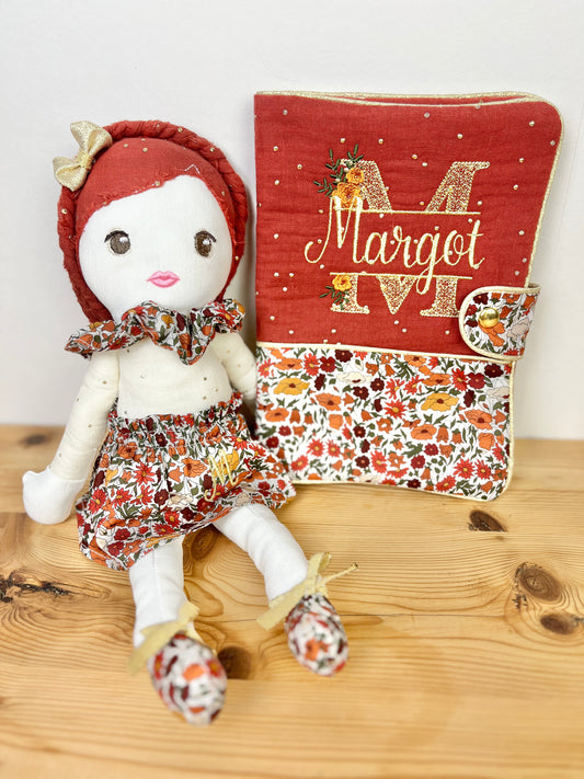 Ensemble : protège carnet et poupée