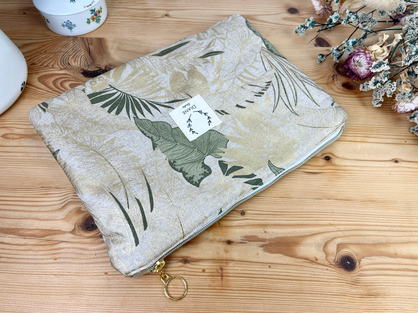 Babette la pochette plate enduite feuillage doré