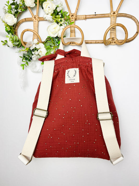 Le sac à dos enfant personnalisé Églantine Liberty théo gold et double gaze tomette doré