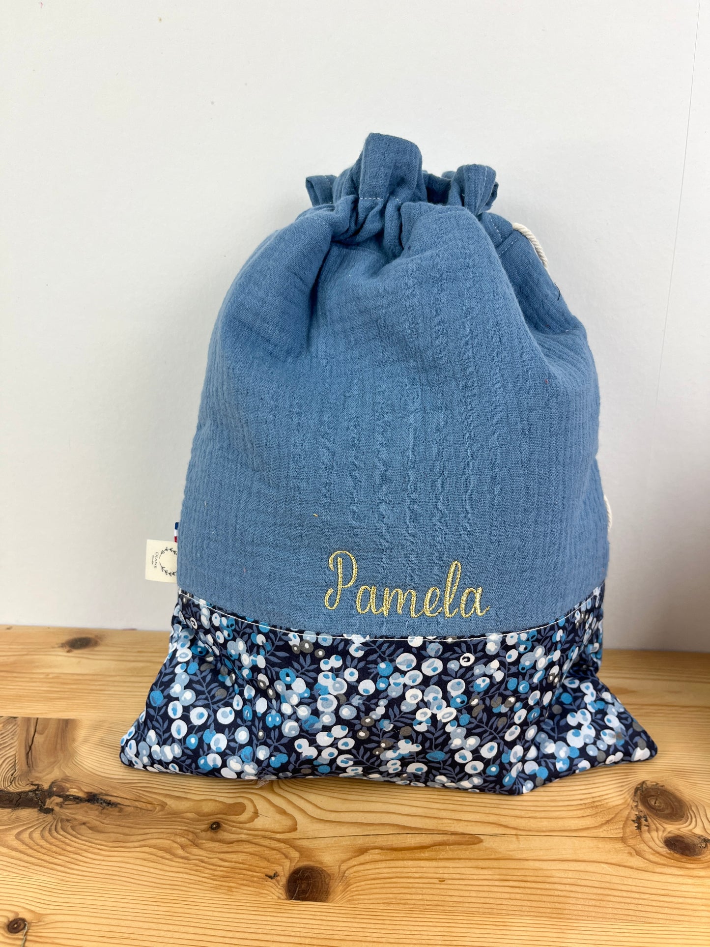 Ensemble : trousse de toilette et pochon brodé