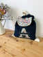 Le sac à dos enfant personnalisé Églantine velours marine et betsy porcelaine