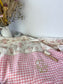 La couverture jacquard et vichy rose