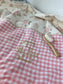 La couverture jacquard et vichy rose