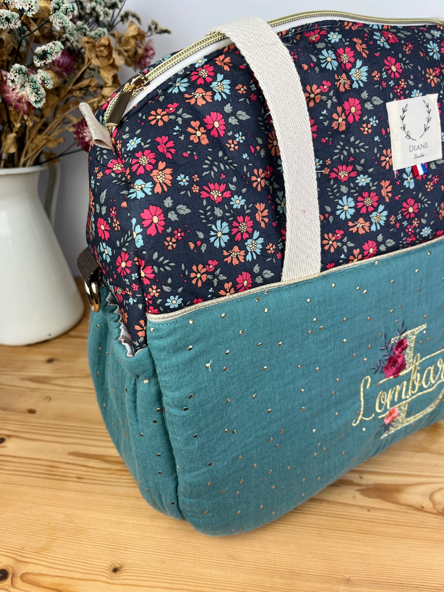 Ensemble : sac à langer, trousse de toilette et trousse de beauté