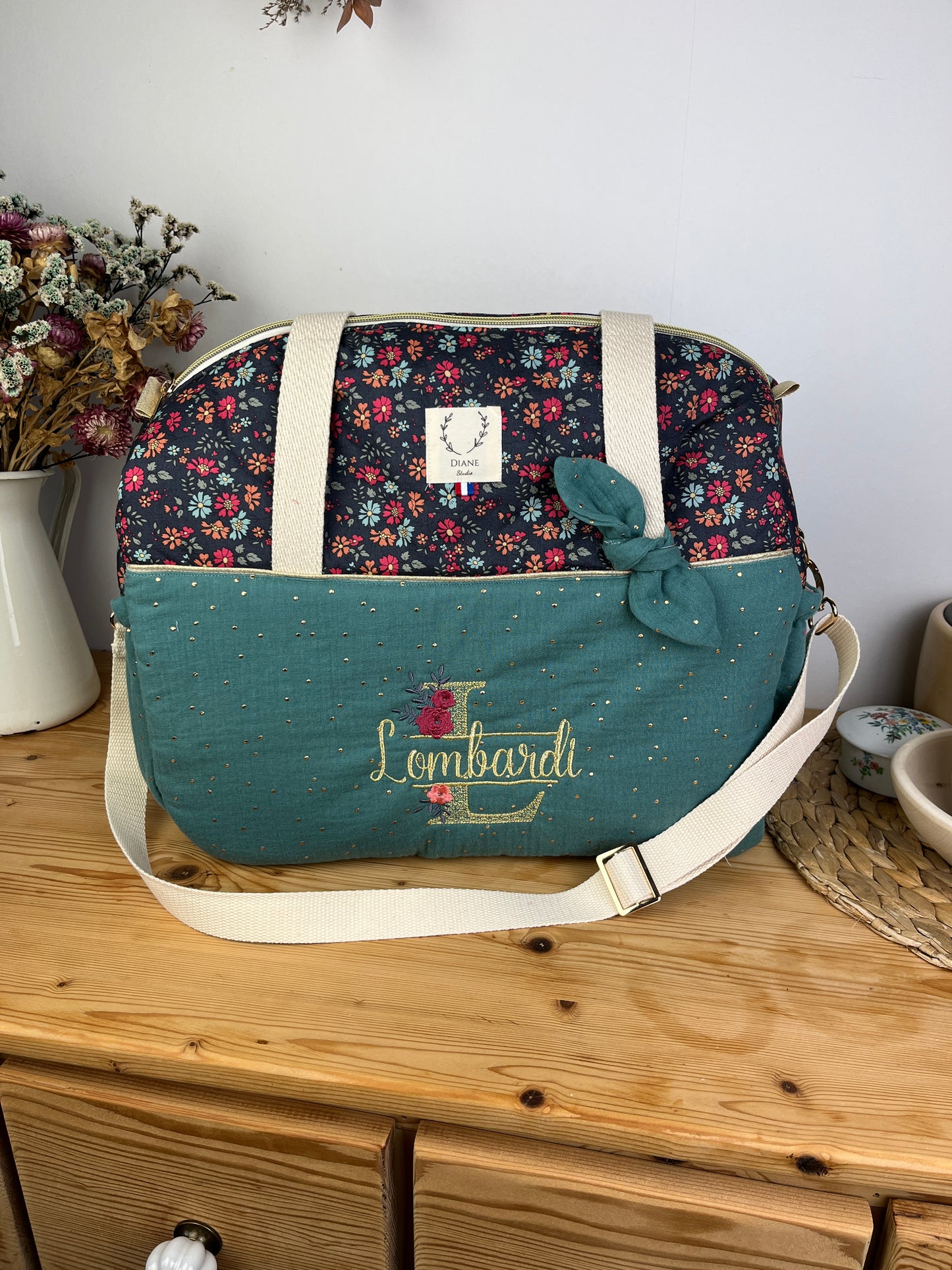 Ensemble : sac à langer, trousse de toilette et trousse de beauté