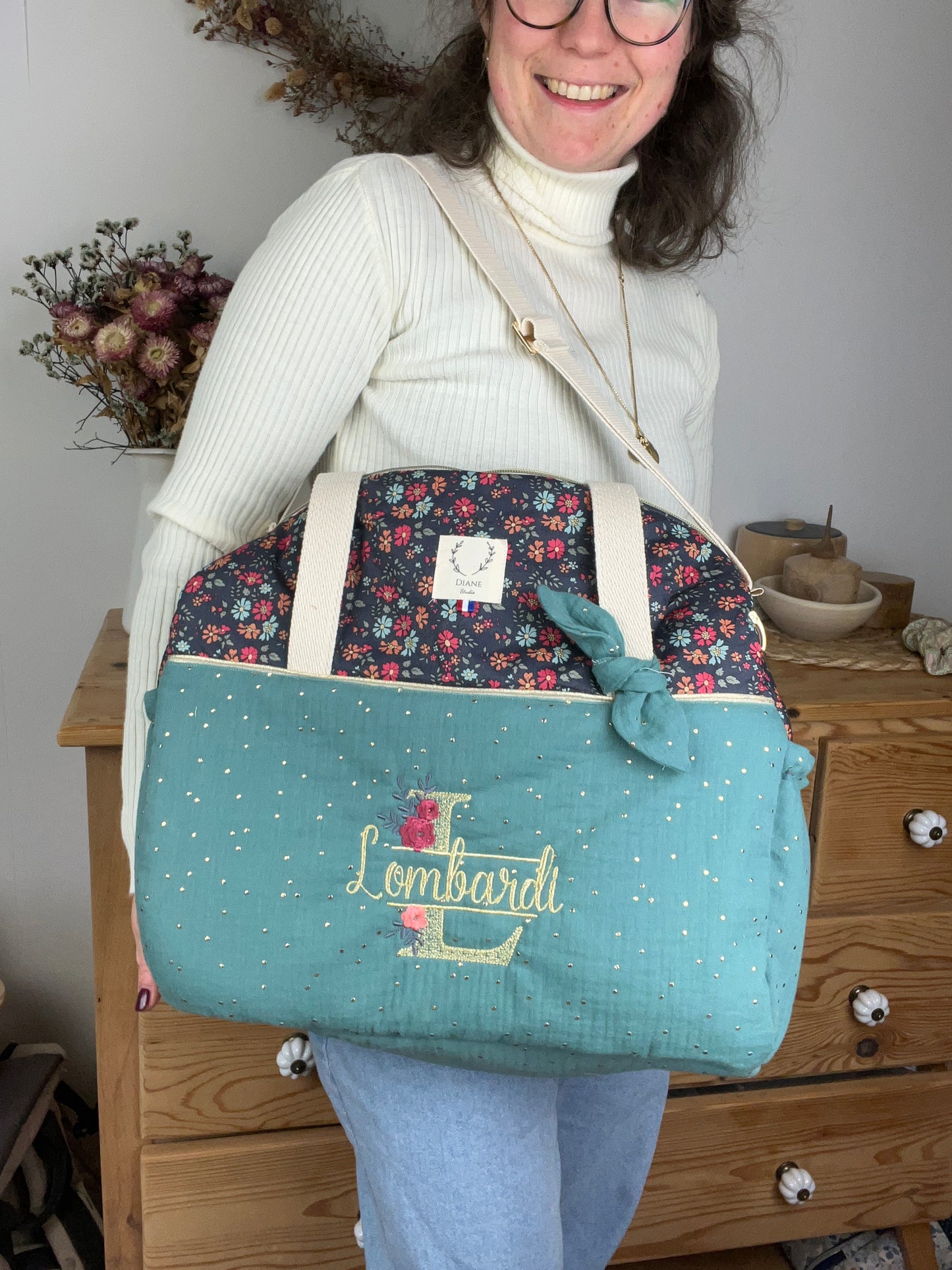 Ensemble : sac à langer, trousse de toilette et trousse de beauté